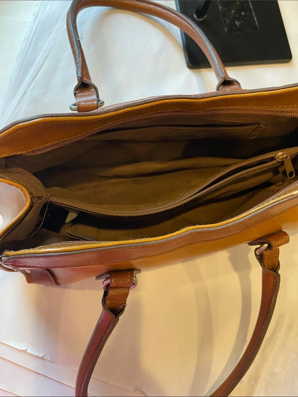 Rina Rich Brown and Tan Leather and vinyl Handbag Label View